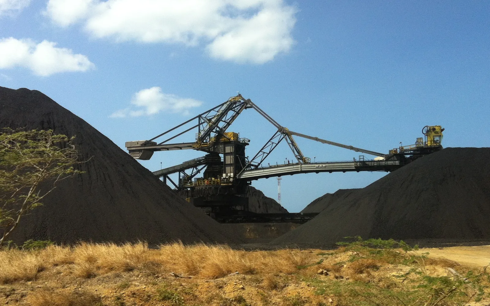 Coal stockpiles and a stacker-reclaimer at Puerto Bolívar, Colombia’s main coal export terminal.